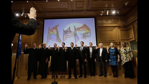 City officials who will perform same-sex marriages are sworn in before conducting wedding ceremonies in West Hollywood on July 1.