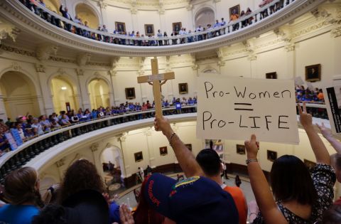 Supporters on both sides of the issue crowd into the rotunda of the state Capitol on July 1, 2013.
