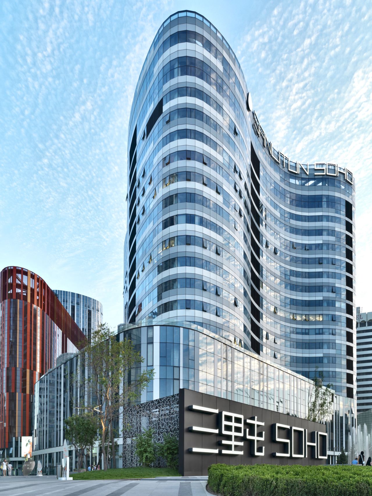 Sanlitun SOHO, completed in 2010, comprises of five shopping malls and nine office or apartment buildings of varying heights in Beijing.