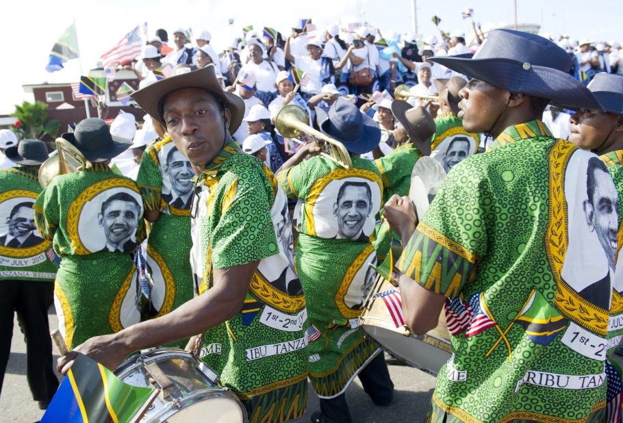 A Tanzanian band plays as the U.S. president and first lady Michelle Obama arrive in Dar es Salaam on Monday, July 1.