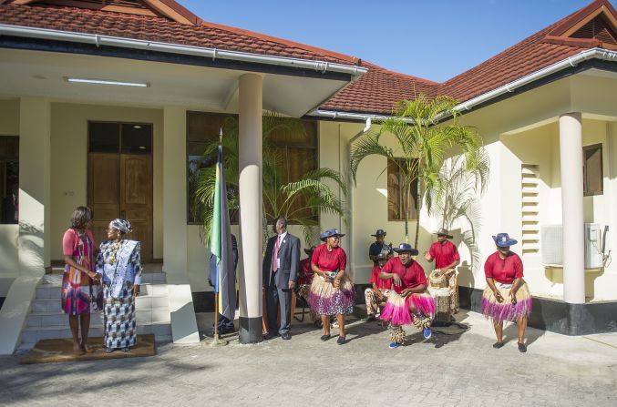 Traditional dancers perform as Tanzanian first lady Mama Salma Kikwete greets Michelle Obama in Dar es Salaam on July 1.