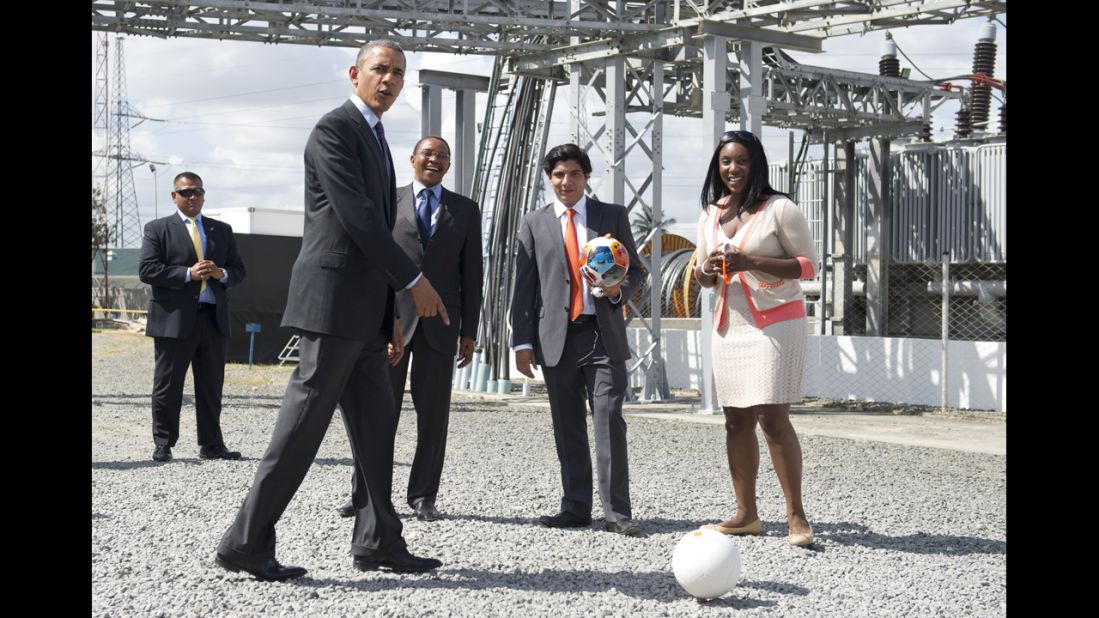 President Barack Obama kicks around an energy-generating soccer ball at a power plant in Dar es Salaam, Tanzania, on Tuesday, July 2. Obama was pushing for partnerships in energy as he concluded a three-nation trip to Africa. Tanzanian President Jakaya Kikwete, third from right, joined Obama at the Symbion Power Plant at Ubungo.