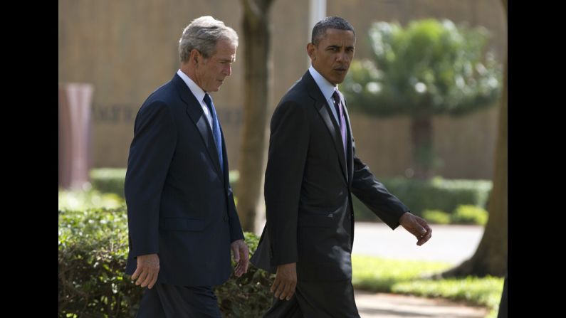 Former President George W. Bush joins Obama during a July 2 wreath-laying ceremony in Dar es Salaam to honor the victims of the 1998 terror attack at the U.S. Embassy in Tanzania.