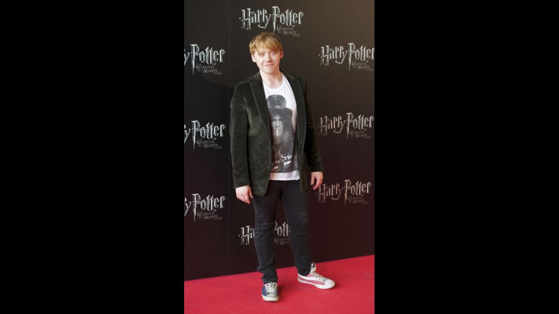 Rupert Grint walks the red carpet in red, white and blue sneakers at the Madrid premiere of "Harry Potter and the Deathly Hallows: Part 2" in June 2011. 