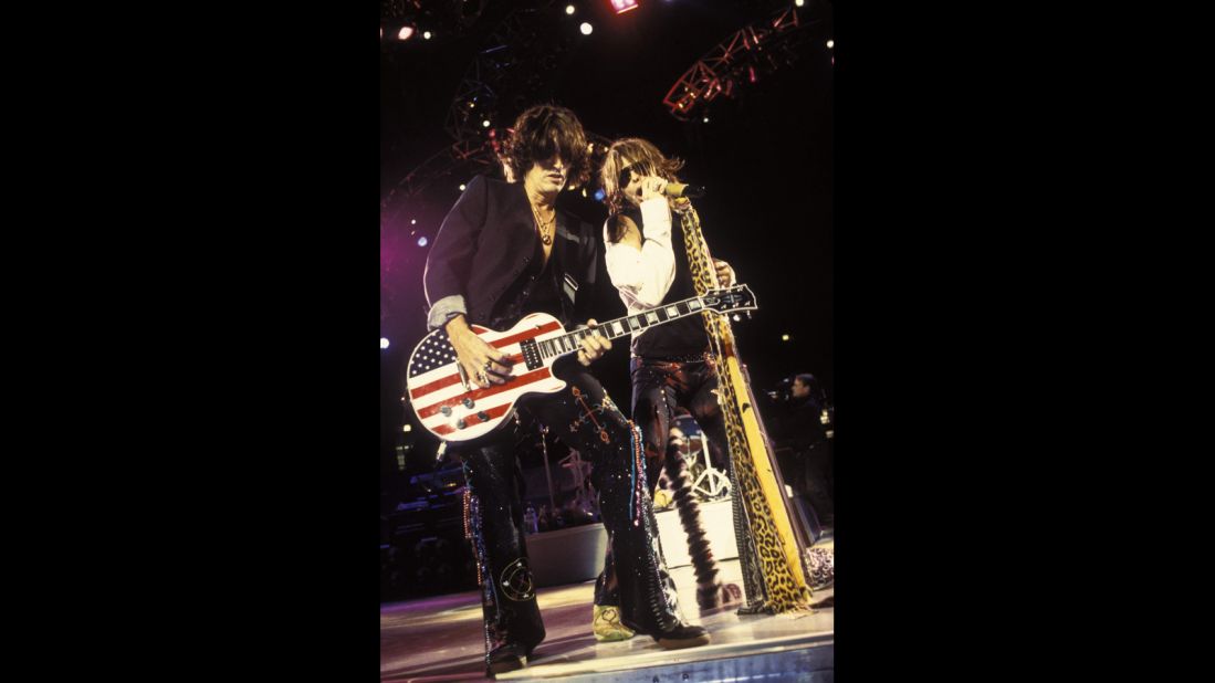 Aerosmith's Joe Perry rocks out on a stars and stripes Gibson Les Paul guitar with Steven Tyler at Madison Square Garden in November 2001.