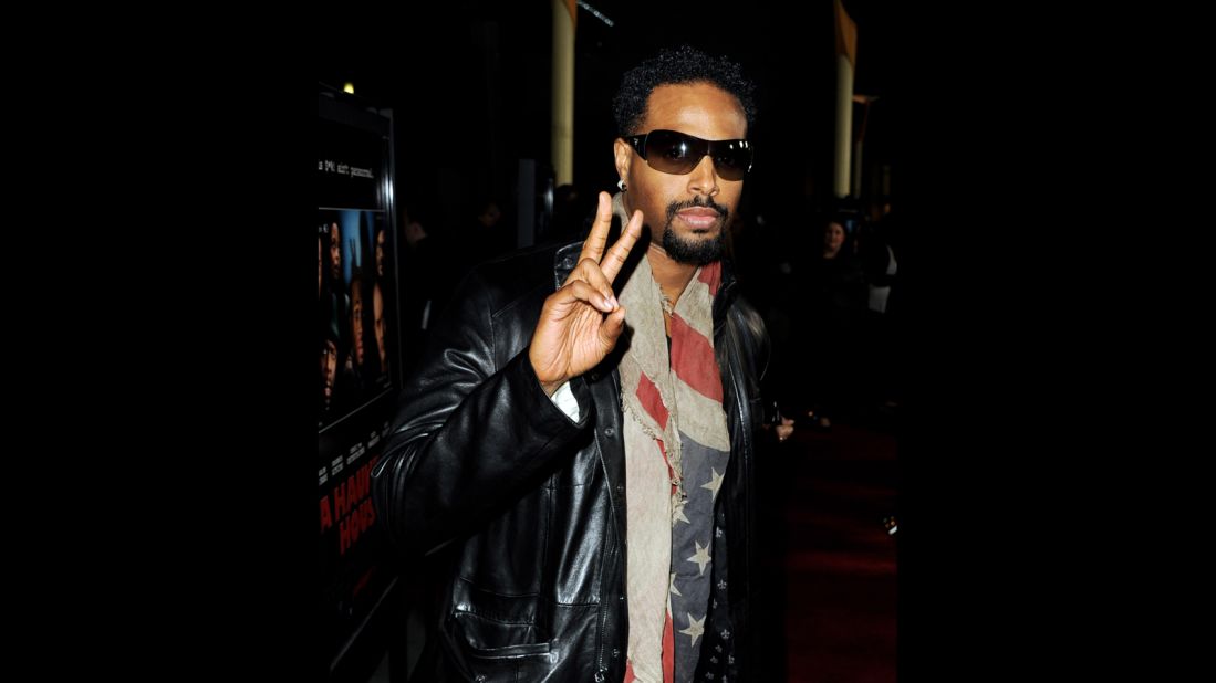 Shawn Wayans tucks his stars and stripes around his neck for the premiere of brother Marlon Wayans' movie, "A Haunted House," in Los Angeles.