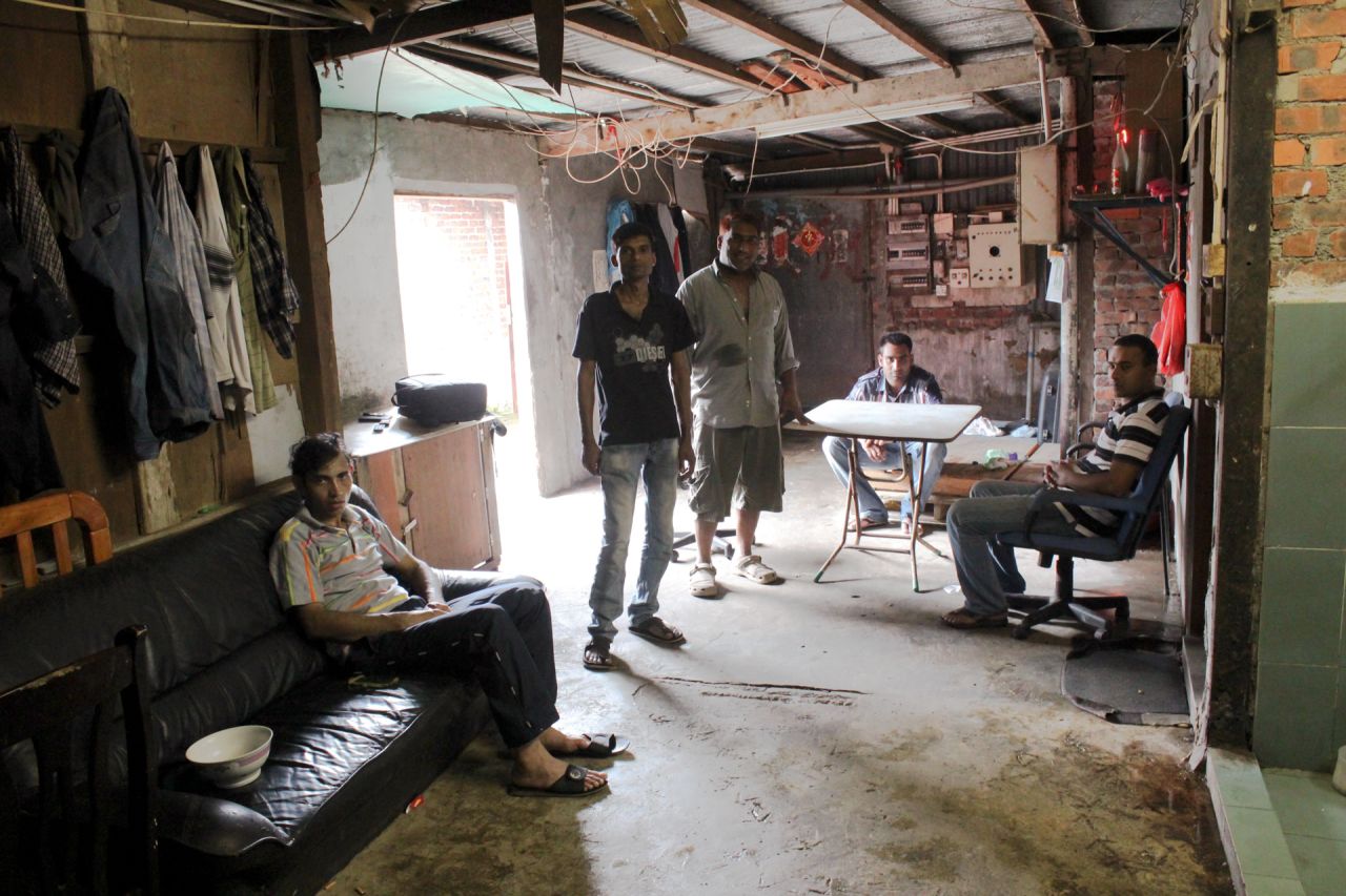 From left to right: Saidur, Hashem, Salim, Hafex, and Johir, refugees from Bangladesh, sit in their home in the slum village of Ping Che on June 25, 2013. All fled their home country due to life-threatening violence, and are now waiting for a refugee status determination.