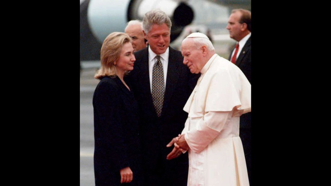 Bill and Hillary Clinton greet Pope John Paul II as he arrives in Newark, New Jersey, on a U.S. trip in October 1995.