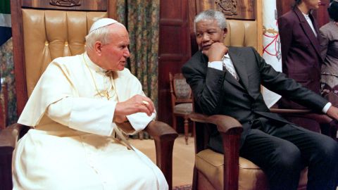 Pope John Paul II visits then-South African President Nelson Mandela at the presidential guesthouse in Pretoria, South Africa, in September 1995.