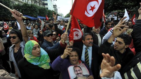 People demonstrate in Tunis in March to mark the 40th day of mourning after the death of Chokri Belaid, a vocal critic of Tunisia's Islamist-led government. <a href="http://www.cnn.com/2013/02/06/world/meast/tunisia-opposition-leader-killed">Belaid, 48, was gunned down</a> outside his home in a Tunis suburb in February. His assassination set off a wave of political instability in Tunisia, which had been widely hailed as the poster child of the Arab Spring.