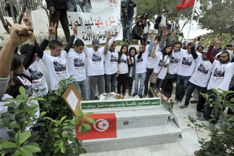 People gather at Belaid's tomb in Tunis during a March demonstration.