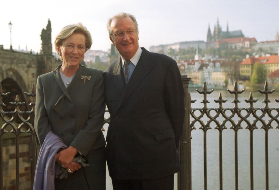 King Albert II and Queen Paola pose in front of the Charles Bridge and Prague Castle on October 24, 2000, in Prague, Czech Republic. 
