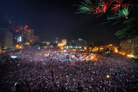 Fireworks light the sky as Morsy opponents celebrate in Tahrir Square on July 3.