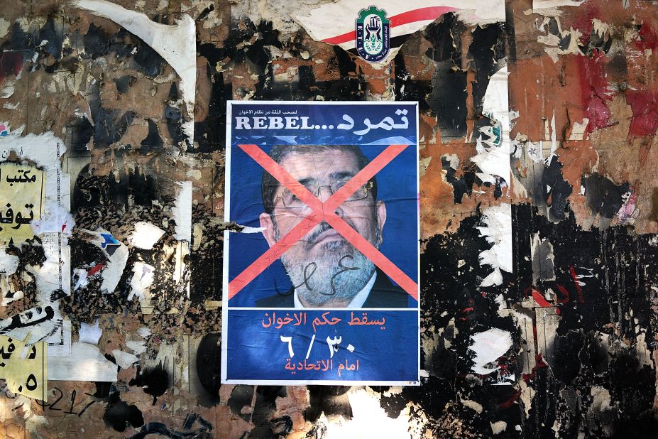 An anti-Morsy poster is displayed on a wall in Tahrir Square on July 3.