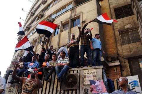Thousands of Egyptian protesters celebrate in Tahrir Square as the deadline given by the military to Morsy passes on July 3.