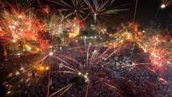 Fireworks light the sky opponents of Egypt's Islamist President Mohammed Morsi celebrate in Tahrir Square in Cairo, Egypt, Wednesday, July 3, 2013. A statement on the Egyptian president's office's Twitter account has quoted Mohammed Morsi as calling military measures "a full coup." The denouncement was posted shortly after the Egyptian military announced it was ousting Morsi, who was Egypt's first freely elected leader but drew ire with his Islamist leanings. The military says it has replaced him with the chief justice of the Supreme constitutional Court, called for early presidential election and suspended the Islamist-backed constitution.(AP Photo/Amr Nabil)