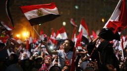 Anti-Morsy protesters wave flags in Tahrir Square on July 3.