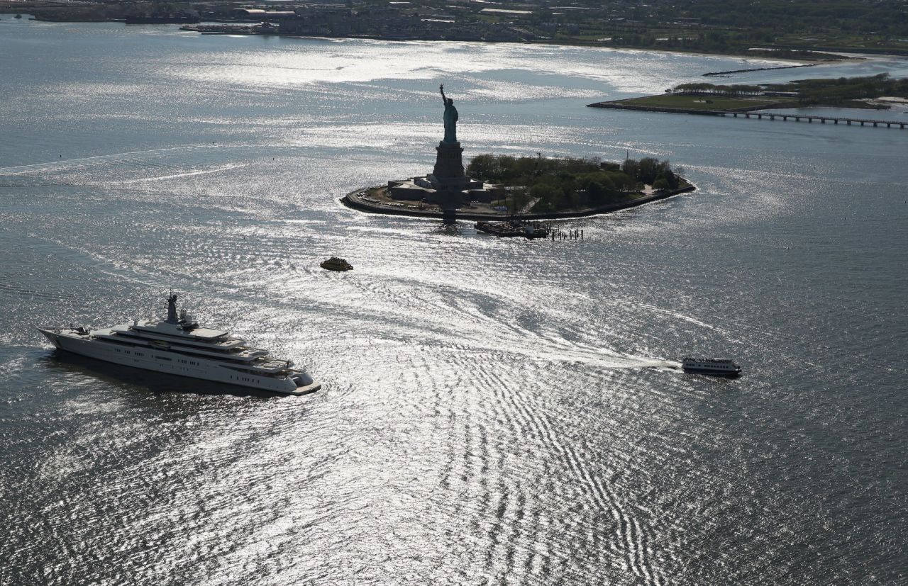 Boats pass the statue in May 2013. It had been closed more than six months following Superstorm Sandy.