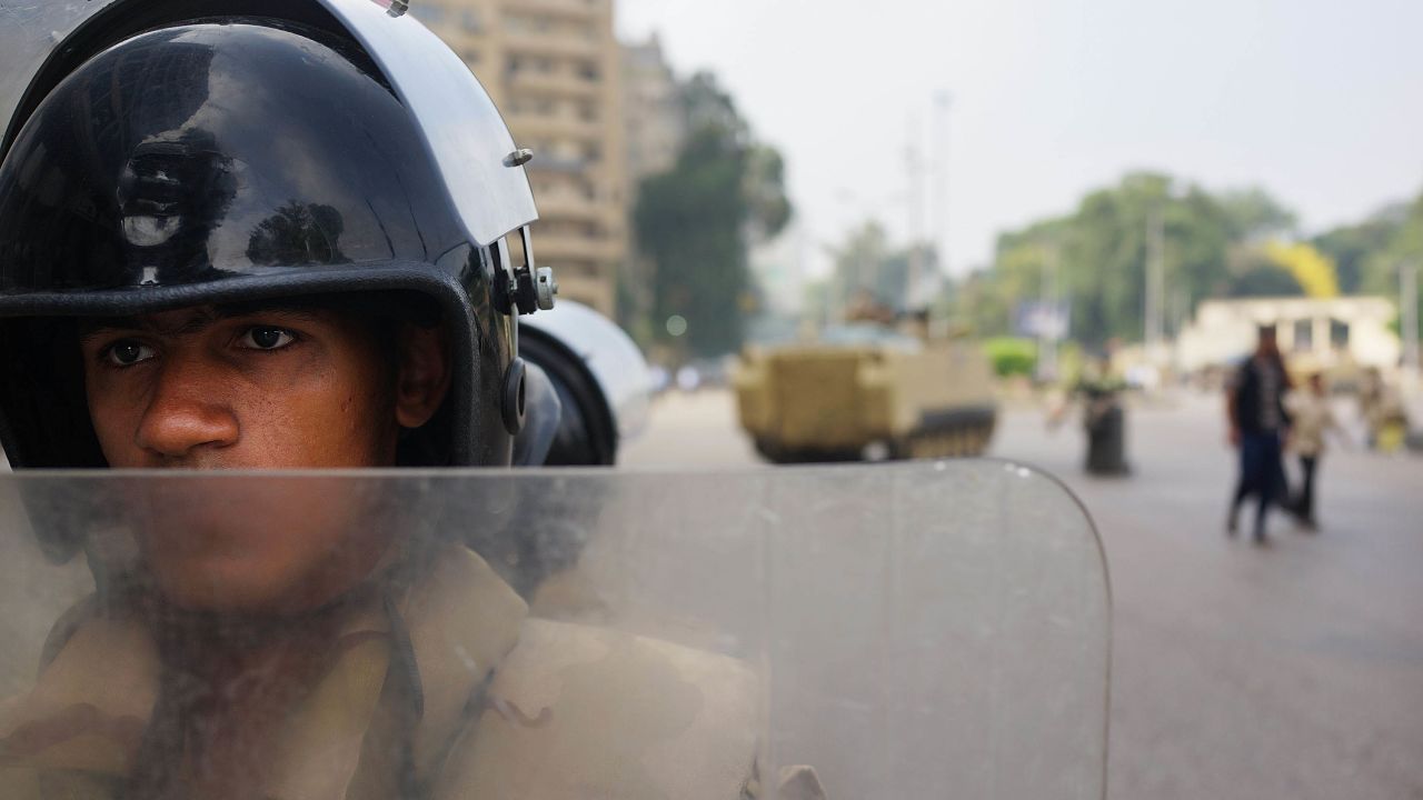 An Egyptian military member guards a roadblock in Giza on July 4.