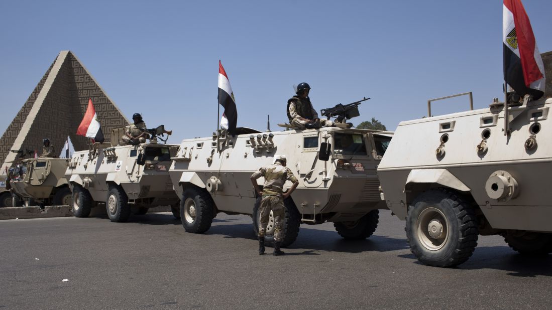 Armored vehicles with the Egyptian army sit at a checkpoint in the Cairo district of Nasr City on July 4.