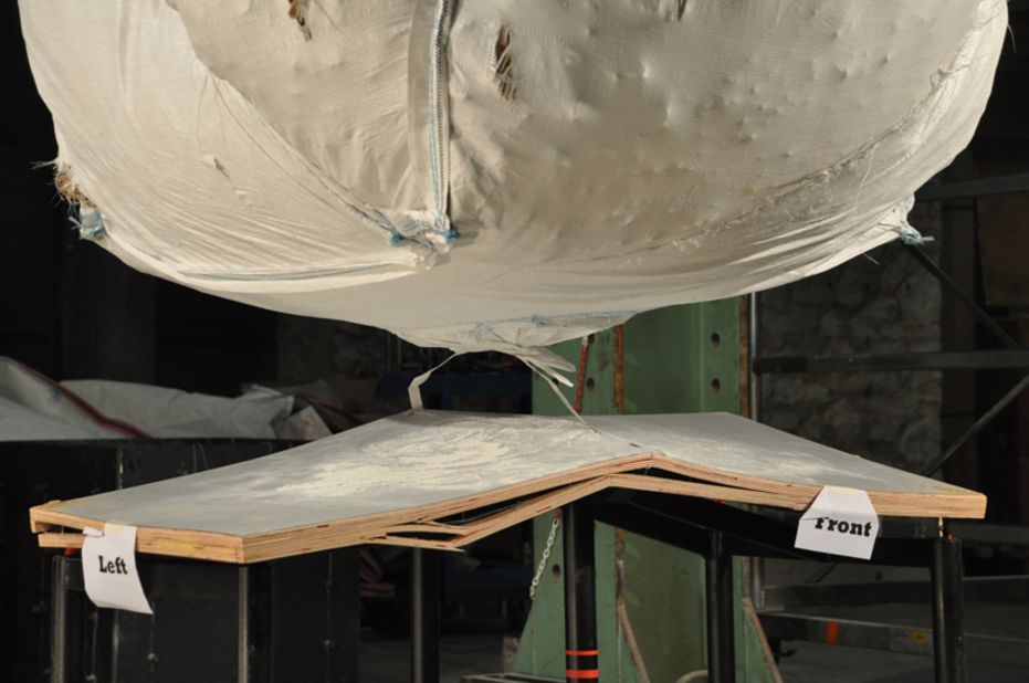 The table is not only strong enough to resist large amounts of pressure but is light enough for two children to lift it and can provide a makeshift walkway to aid rescue efforts.