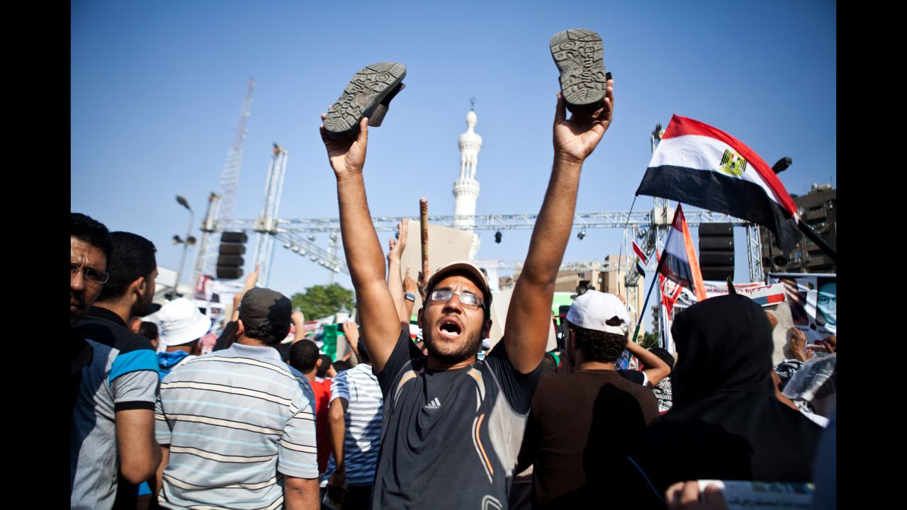 A Morsy supporter reacts as a military helicopter flies over during a July 4 rally in Nasr City.