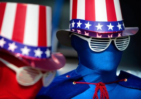 Decked out from head to toe in patriotism, 9-year-old Remi Schaber, left, and her brother Chase, 11, don spandex suits for the Independence Day parade in Cordova, Tennessee.