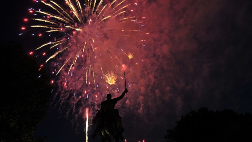 Fireworks light up the statue of Simon Bolivar during Independence Day celebrations on July 4, 2013 in Washington, DC. Independence Day celebrates the US declaring independence from Britain in 1776. AFP PHOTO/Mandel NGAN (Photo credit should read MANDEL NGAN/AFP/Getty Images)