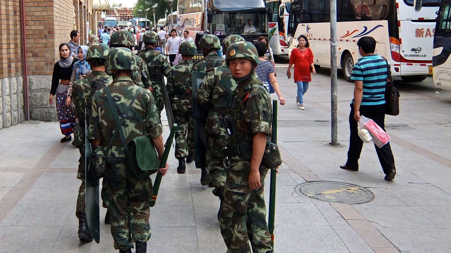 Paramilitary police patrol the streets in the Xinjiang capital earlier this year. . 
