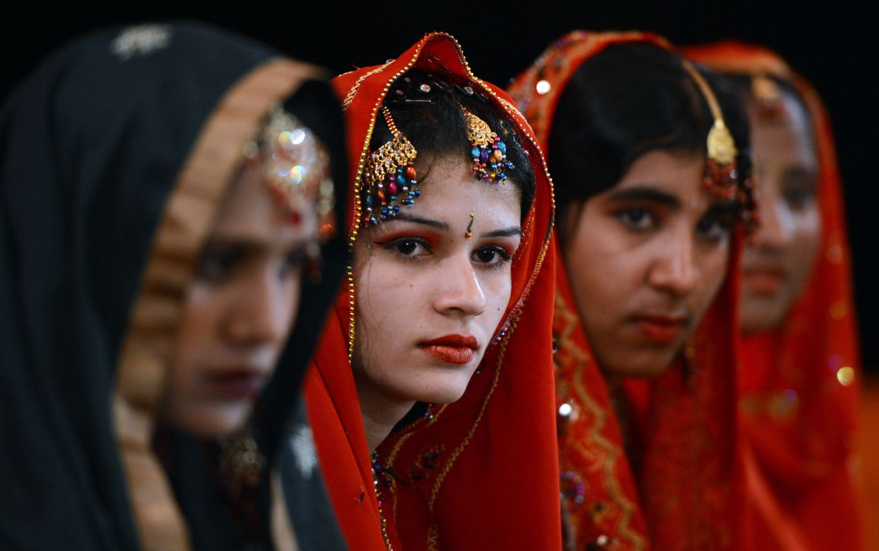 Pakistani brides attend a mass marriage ceremony in Karachi. Some 110 couples participated in the ceremony organized by a local charity welfare trust.
