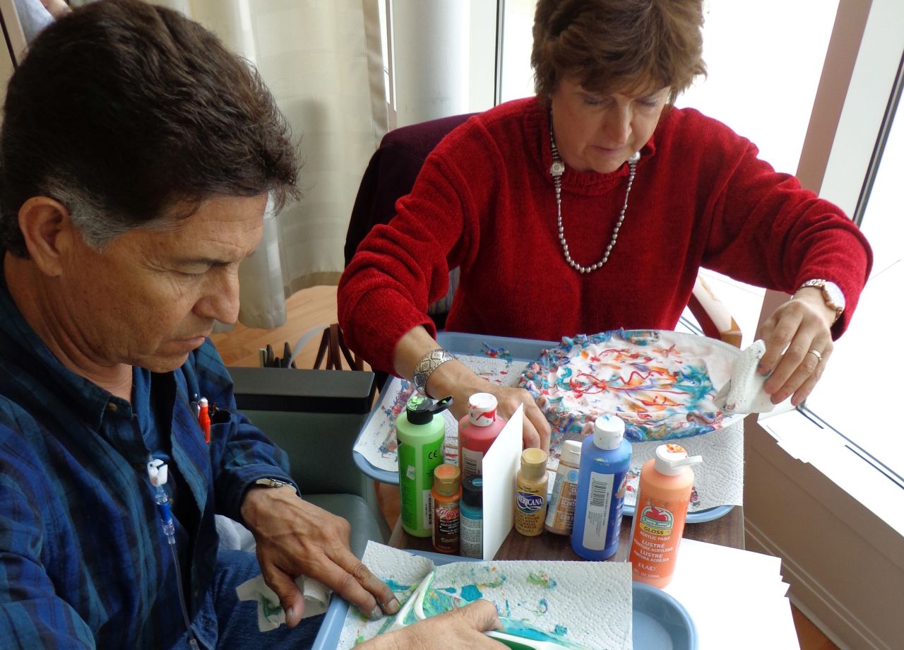 Max Chavez, a University of New Mexico Hospital cancer patient, and his wife, Beth, work on art projects. Chavez makes greeting cards and says the art projects give him "something to do creatively that I wasn't doing because I was pretty depressed."
