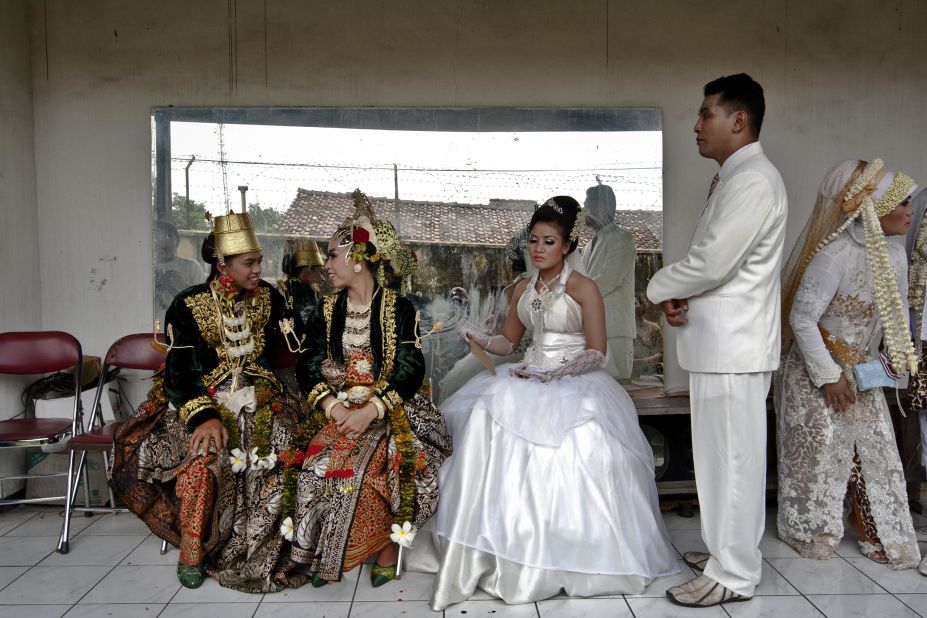 Couples prepare for marriage during a mass wedding ceremony on December 12, 2012, in Yogyakarta, Indonesia. The day saw a surge in marriage around the globe to mark 12/12/12.
