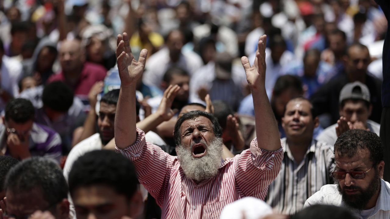 Morsy supporters pray near the University of Cairo in Giza on July 5.