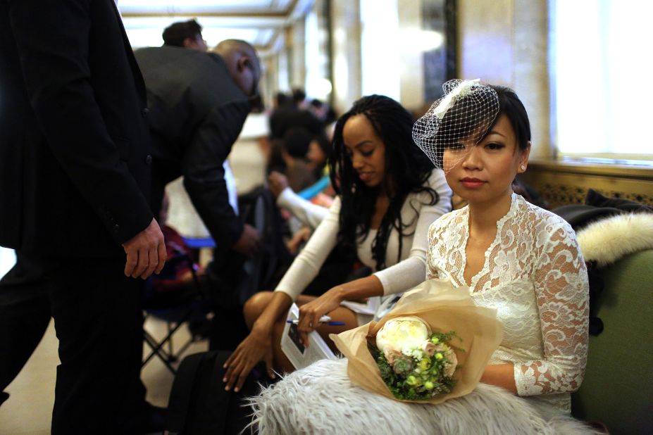 Lini Sasanto waits to fill out marriage papers at a busy City Clerk's office on December 12, 2012, in New York.