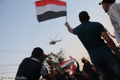 <a href="http://ireport.cnn.com/docs/DOC-999917">Norman Halim</a> also captured this striking image earlier July 3 of an army helicopter hovering over the crowd.