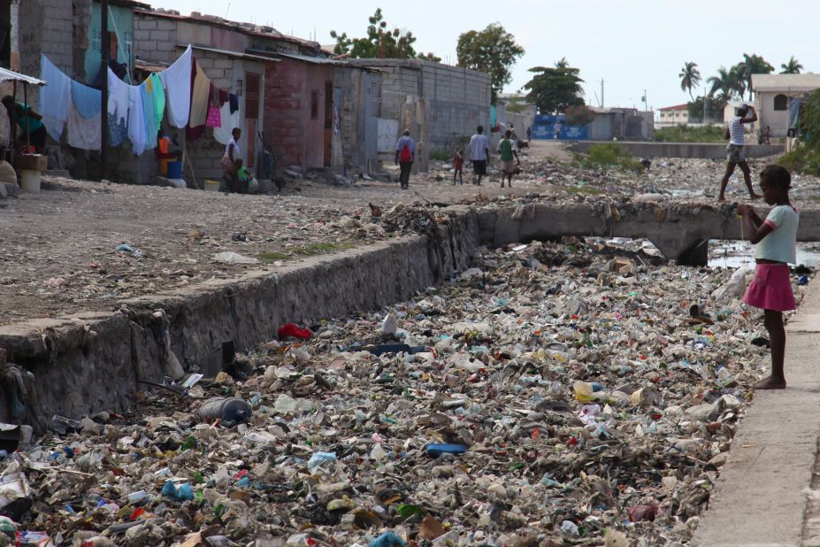 Imagine living with this on your doorstep. Residents of Haiti's Cite Soleil slum endure shockingly bad sanitation with garbage clogging the district's sewer canals. 
