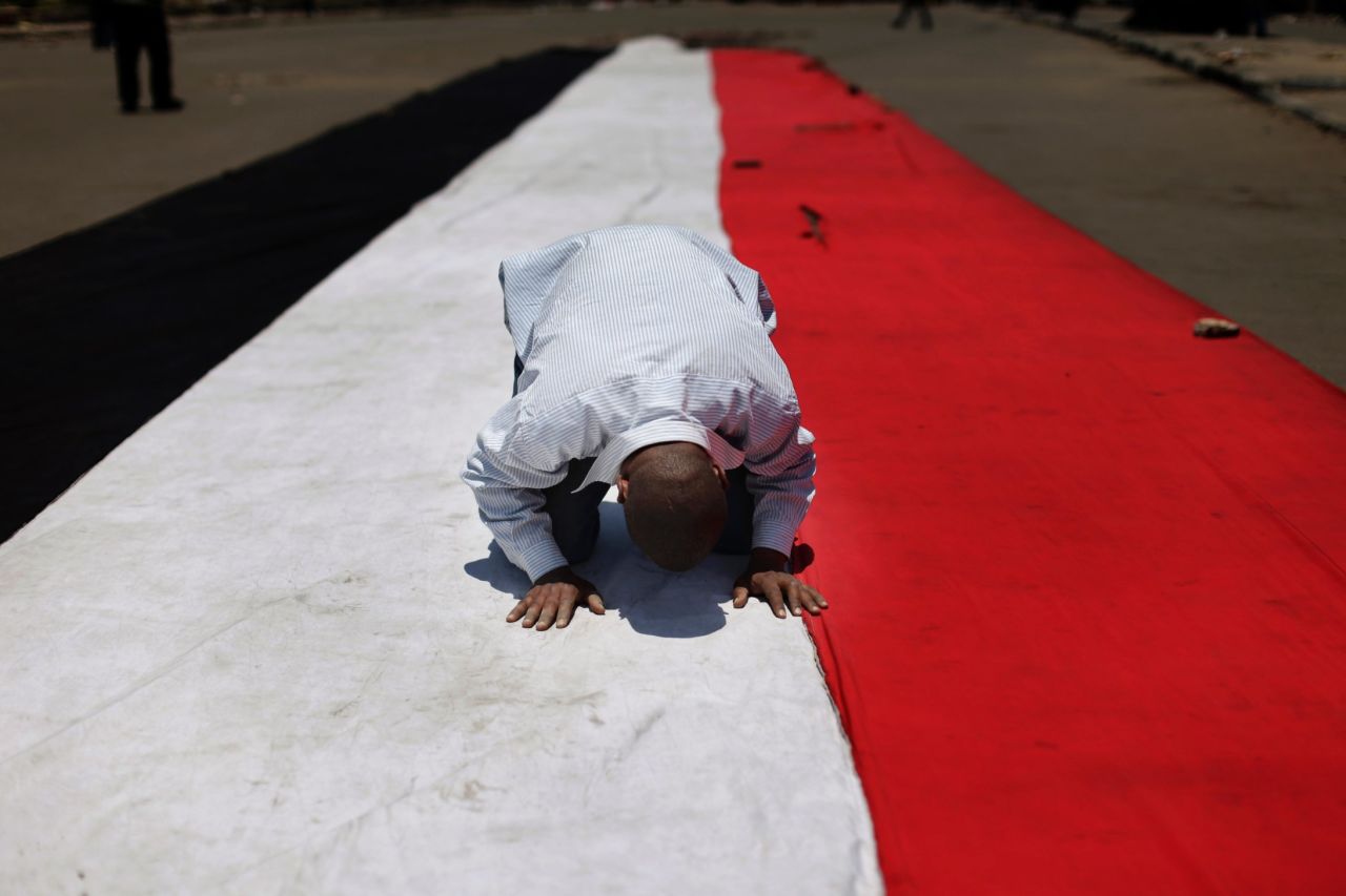 A man prays on July 5 before the protest near the University of Cairo.