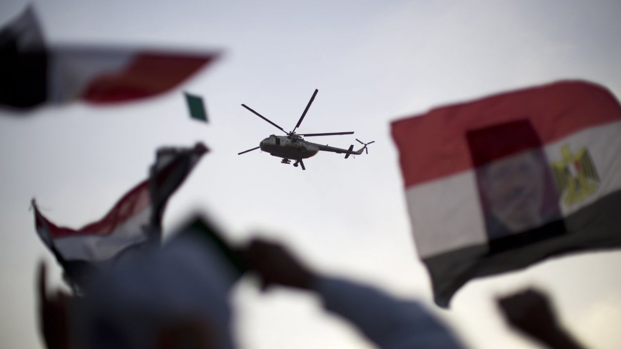 An Egyptian military helicopter hovers over supporters of the Muslim Brotherhood and deposed President Mohamed Morsy in Cairo on July 5.