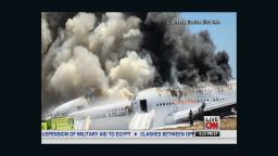 Smoke billows from Asiana flight 214 after it crashed at San Francisco International Airport on Saturday, July 6.