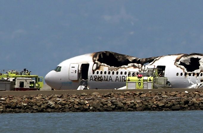 The Boeing 777 lies burned on the runway after it crashed landed on July 6.