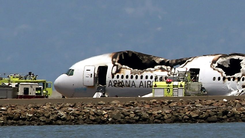 The Boeing 777 airplane lies burned on the runway after it crashed landed on July 6.