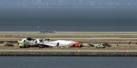 Crews surround the remains of the plane on July 6.