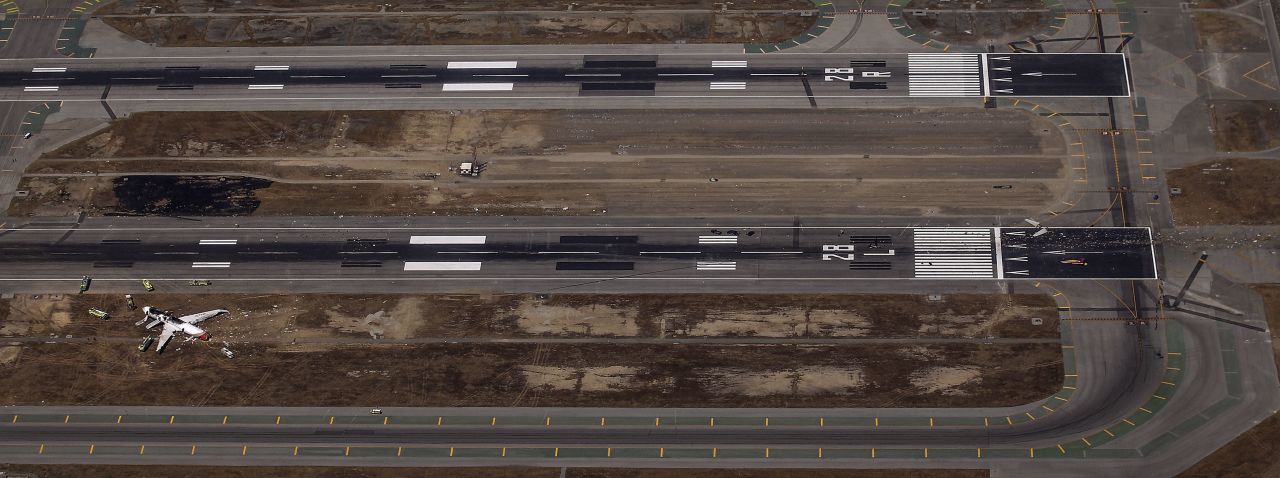 An aerial view shows the site of the crash landing between the runways on July 6.