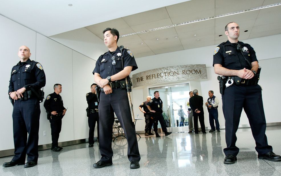 Police guard the Reflection Room at the San Francisco airport's international terminal, where passengers from Asiana Airlines Flight 214 were reportedly gathering after the crash landing on July 6.