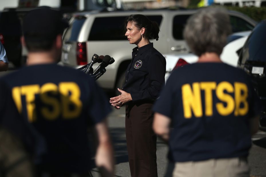 Deborah Hersman, chairwoman of the National Transportation Safety Board, speaks to the press at Reagan National Airport in Arlington, Virginia, before departing for San Francisco with an NTSB crew on July 6 to investigate the crash site.
