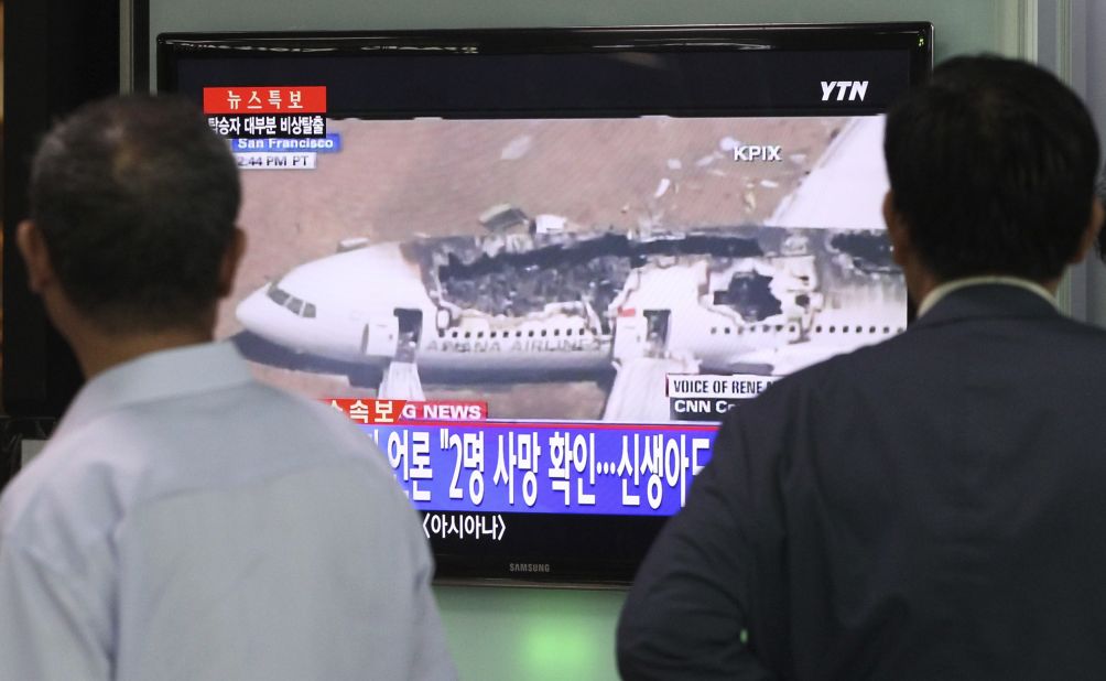 People in Seoul watch a news program reporting about the crash landing on July 6 in San Francisco. Asiana Airlines Flight 214 took off from Seoul earlier Saturday.