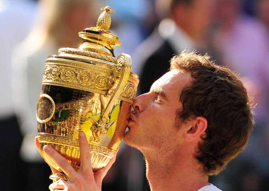 Murray gets his hands on the famous Wimbledon trophy much to the delight of a raucous Centre Court crowd.
