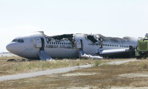 In this handout photo released by the National Transportation Safety Board, Asiana Airlines Flight 214 sits just off the runway at San Francisco International Airport on Sunday, July 7. The Boeing 777 coming from Seoul, South Korea, crashed on landing on Saturday, July 6. Three passengers, all girls, died as a result of the first notable U.S. air crash in four years.