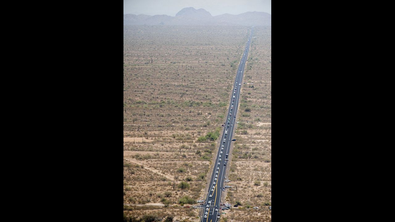 An aerial view shows the procession on the 100-mile trip from the Medical Examiner's office in Phoenix to the firefighters' home base in Prescott on July 7.