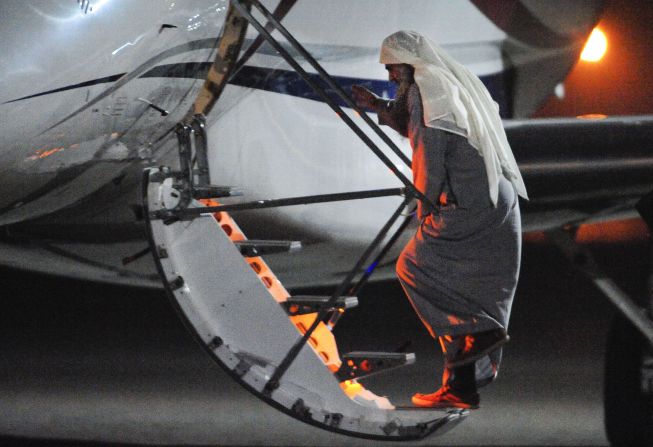 Abu Qatada boards a small aircraft bound for Jordan on July 7, ending eight years of government efforts to send him home for trial on charges of alleged terrorism.